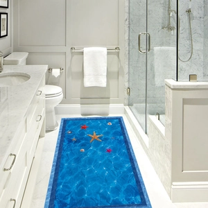 3D ocean floor mat with vivid starfish and shells on blue sea ripples in a white bathroom
