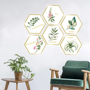 Detail of hexagonal Nordic watercolor botanical wall stickers with golden border on white wall