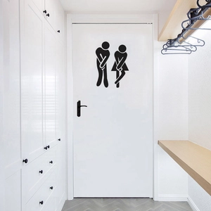 Funny stick figure restroom wall sticker with male and female silhouettes on a white door