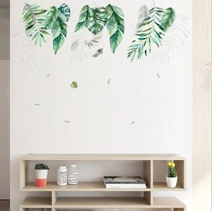 Detail of Nordic tropical leaf wall stickers featuring green monstera and palm foliage