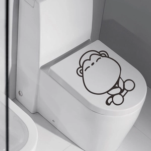 Cute cartoon monkey wall sticker on white toilet lid for bathroom decor