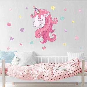Detail of cartoon pink unicorn wall sticker with colorful stars and flowers in kids room