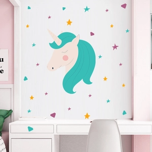 Detail of cartoon unicorn wall sticker with colorful stars and diamonds in a kids room