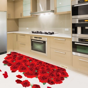 Detail of 3D red rose floor stickers with fallen petals in a modern kitchen setting