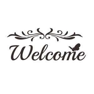 Detail view of black Welcome wall sticker with scroll patterns and butterfly silhouette