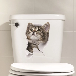 3D realistic tabby kitten sticker appearing to tear through a white ceramic surface