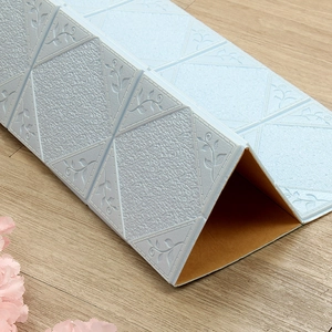 Macro detail of light blue 3D diamond pattern wall sticker with floral embossing texture