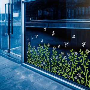Self-adhesive green grass baseboard wall stickers with white dragonflies on glass door