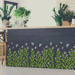 Self-adhesive green grass wall sticker with dragonflies on dark wood baseboard decor