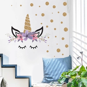 Golden unicorn wall decal with floral crown and gold dots for nursery decoration