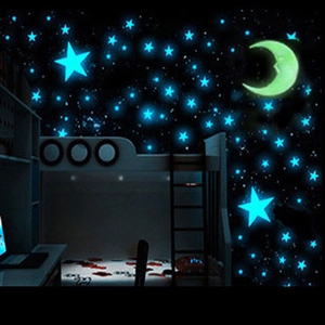 Luminous wall stickers set with dark blue stars and yellow moon for nursery room decor