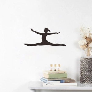 Detail of black gymnast silhouette wall sticker showing a leaping split on white wall