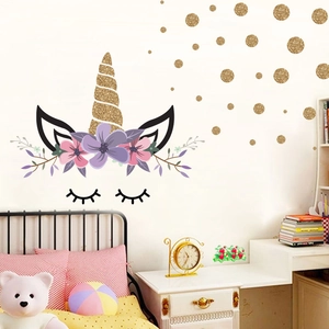 Unicorn wall decal with golden glitter dots and pink flowers for children room