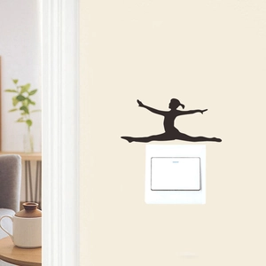 Detail of gymnast silhouette wall sticker above a light switch in a cozy home setting