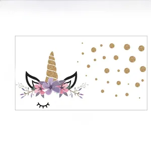 Detail view of unicorn wall sticker set with golden polka dots and floral crown for kids room
