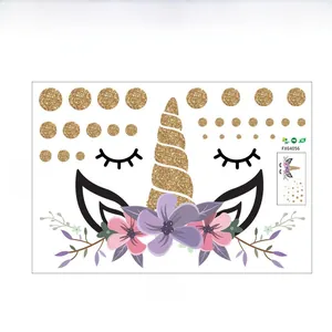 Unicorn wall decal layout with golden dots and pink flowers measuring 60cm by 40cm