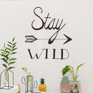 Stay Wild quote wall sticker with decorative arrow in black minimalist home decor