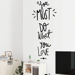 Detail of DIY wall sticker featuring 'You MUST DO WHAT YOU LOVE' cursive typography decor