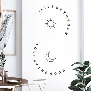 Minimalist sun and moon wall decal with Live by the Sun Love by the Moon quote