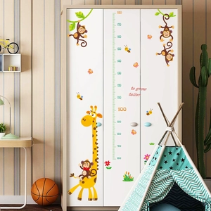 Detailed wall sticker featuring cartoon giraffe and monkey height chart on a white wardrobe