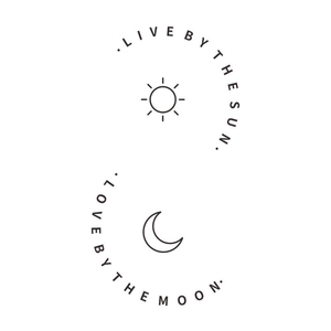 Detail of minimalist sun and moon wall sticker with Live by the Sun Love by the Moon text