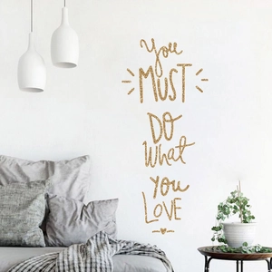 Detail showing glitter gold 'Do What You Love' quote wall sticker in bedroom decor