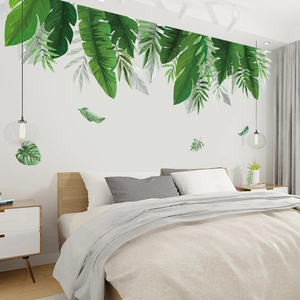 Détail de stickers muraux feuilles de monstera tropical pour une chambre verte et naturelle