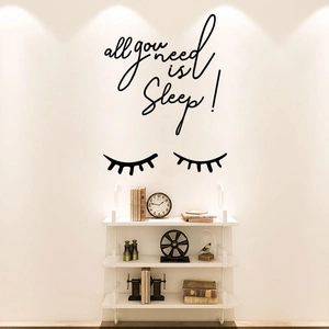 Minimalist 'All You Need Is Sleep' black wall decal with eyelash art for cozy bedroom decor