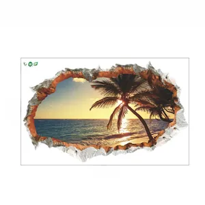 Close-up of 3D cracked wall sticker showing tropical beach sunset and palm trees