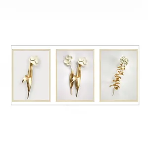 Detail of three-piece gold floral relief wall art with 98x37cm dimensions and wood frames