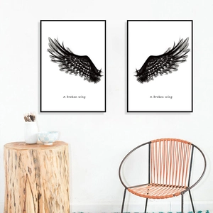 Minimalist black wings wall art set with slim black frames for modern home decor