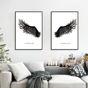 Modern black and white wings wall art set in black frames for minimalist home decor