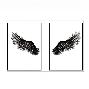 Detail view of black wing wall stickers showing total width 70cm and height 38cm