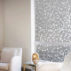 Frosted mosaic glass privacy film for windows with gray pixel square patterns in a modern living room