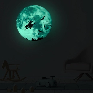 Luminous Halloween wall decal showing a glowing moon with witch and bat silhouettes