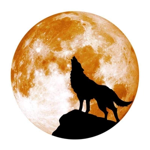 Detail showing orange textured moon with black howling wolf silhouette wall sticker