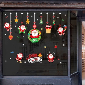 Christmas window stickers featuring Santa Claus, wreaths and trees on glass