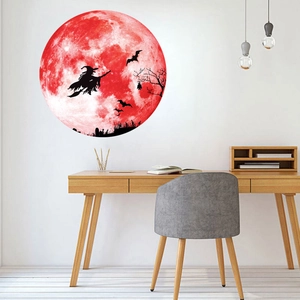 Detail showing self-adhesive glowing moon wall sticker with witch and bats for Halloween