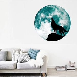 Luminous moon and howling wolf wall sticker in a minimalist living room interior