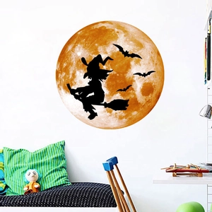 Glow-in-the-dark Halloween wall sticker featuring an orange moon and witch silhouette