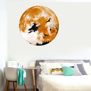Luminous Halloween wall sticker featuring witch on broom silhouette against a moon