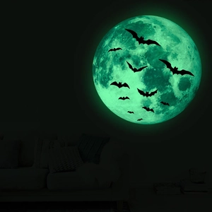Luminous Halloween wall stickers featuring a large glowing moon and black bats on dark wall