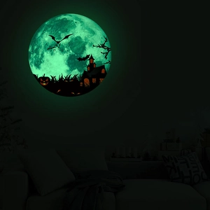 Luminous Halloween wall sticker showing a glowing green moon with spooky castle and bats