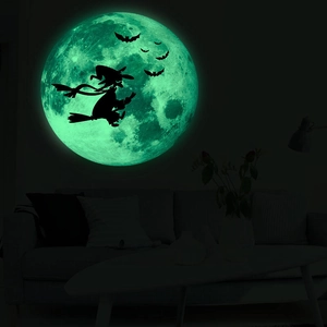 Luminous Halloween wall decal featuring a glowing green moon with witch and bat silhouettes