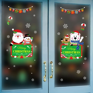 Christmas window stickers featuring Santa, snowman, and reindeer on glass doors
