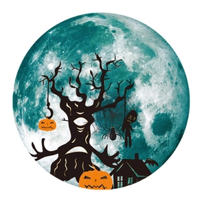 Detailed view of Halloween luminous moon sticker with silhouette tree and pumpkins