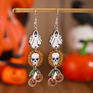 Detail of wooden Halloween earrings featuring ghost, skull, and pumpkin charms