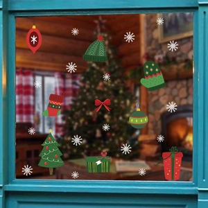 Close-up of Christmas window clings with snowflake, stocking, and glove festive designs