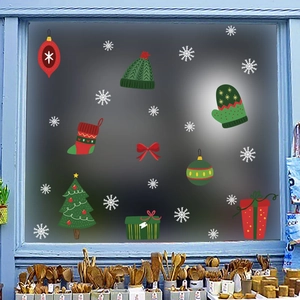 Detailed Christmas static window stickers with snowflakes and festive ornaments on glass