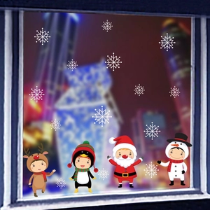 Close-up of festive Christmas window stickers featuring Santa and snowflake decals